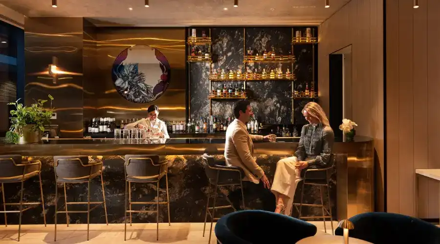 A couple enjoying a drink at Dorsett Melbourne’s Jin Bar. 