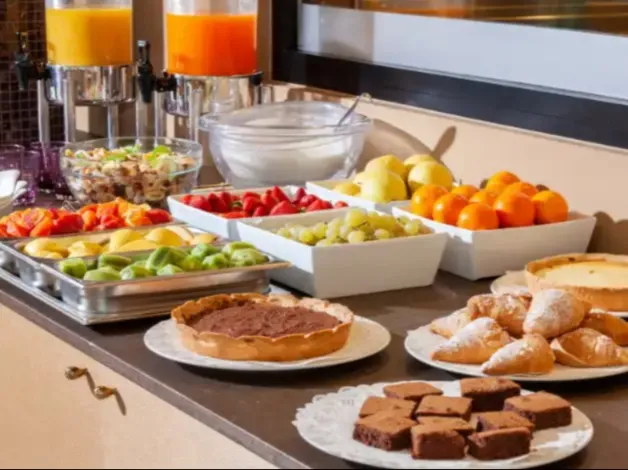 Baked goods and fruits in Buffet Breakfast.