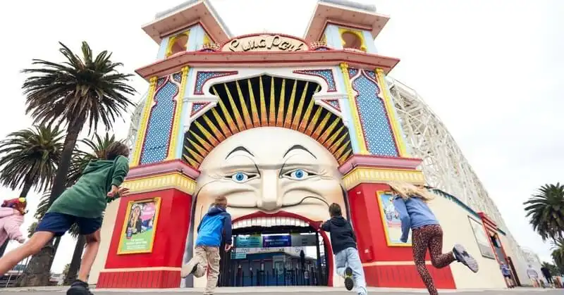 Children run into Luna Park Melbourne
