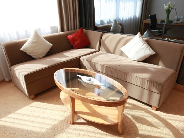 Sofa and a coffee table in a Dorsett Wuhan Hotel room.