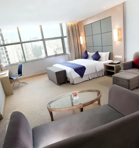 Interior of Dorsett Wuhan Deluxe Room with city views.