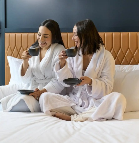 Ladies having in-room coffee at Dorsett Melbourne