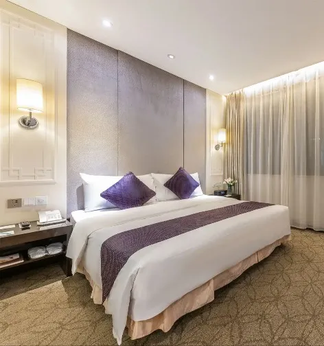 King bed by the window at Dorsett Wuhan Hotel Deluxe Room.
