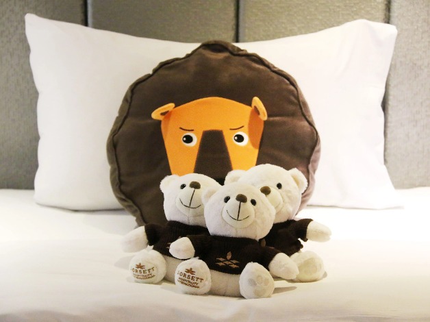 Soft toys on a bed.