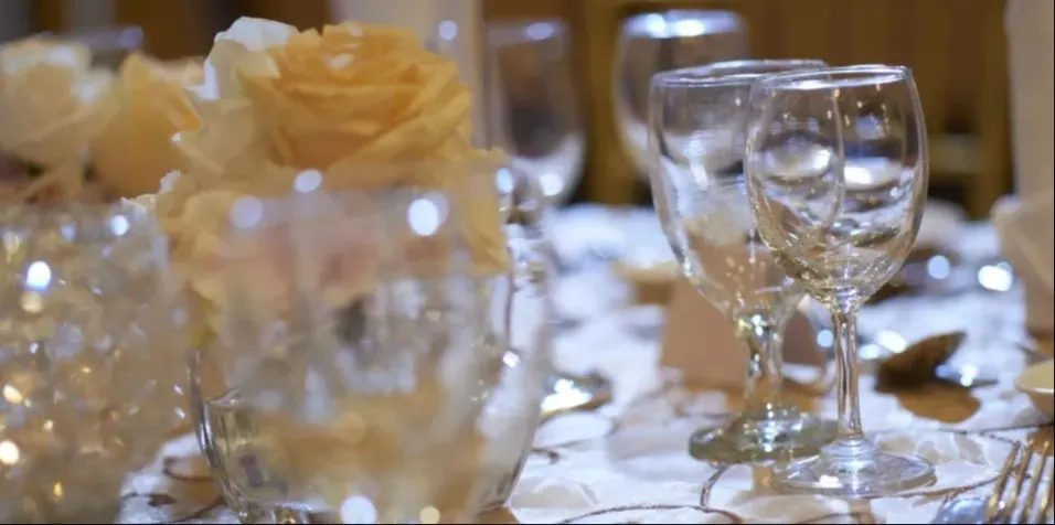 Glasses, cutleries and flowers on a round table in the Selangor venue.