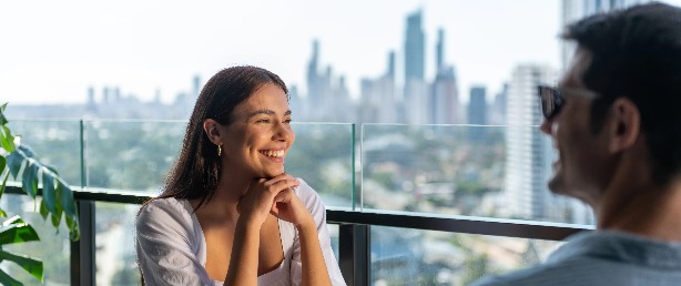 A couple in a hotel balcony.
