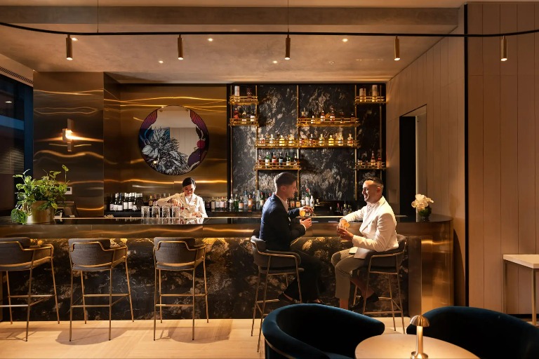 Men enjoying drinks at Dorsett Melbourne Jin Bar