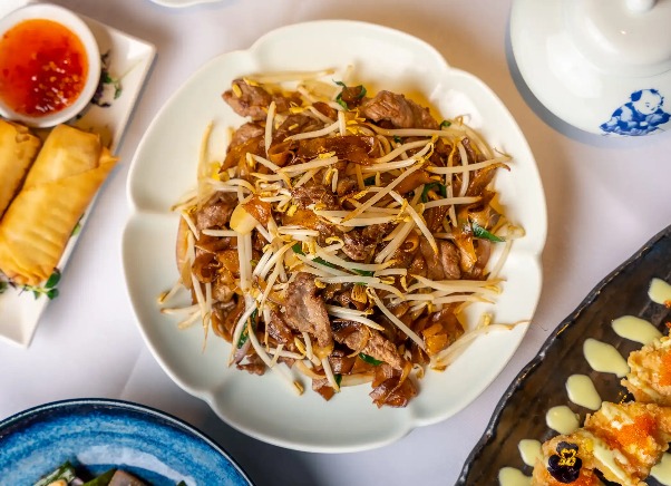 Beans sprouts and chicken with other side dishes at Shikumen.