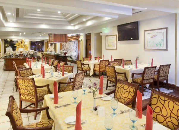 Seating arrangements with warm lights at Victoria's Brasserie.